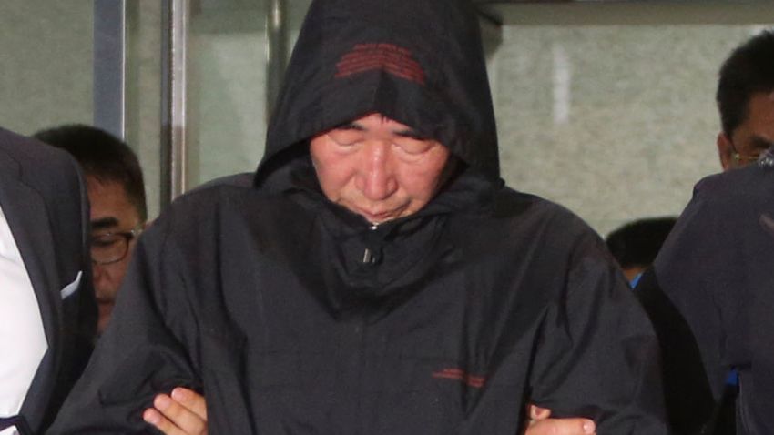 Lee Joon-seok, center, the captain of the sunken ferry Sewol in the water off the southern coast, leaves a court which issued his arrest warrant in Mokpo, south of Seoul, South Korea, Saturday, April 19, 2014. The investigation into South Korea's ferry disaster focused on the sharp turn it took just before it began listing and on the possibility that a quicker evacuation order by the captain could have saved lives, officials said Friday, as rescuers struggled to find some 270 people still missing and feared dead. (AP Photo/Yonhap) KOREA OUT
