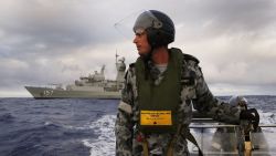 Leading Seaman, Boatswain's Mate, William Sharkey searching for debris on an inflatable boat as HMAS Perth searches for missing Malaysia Airlines flight MH 370 in the southern Indian Ocean on April 13.
