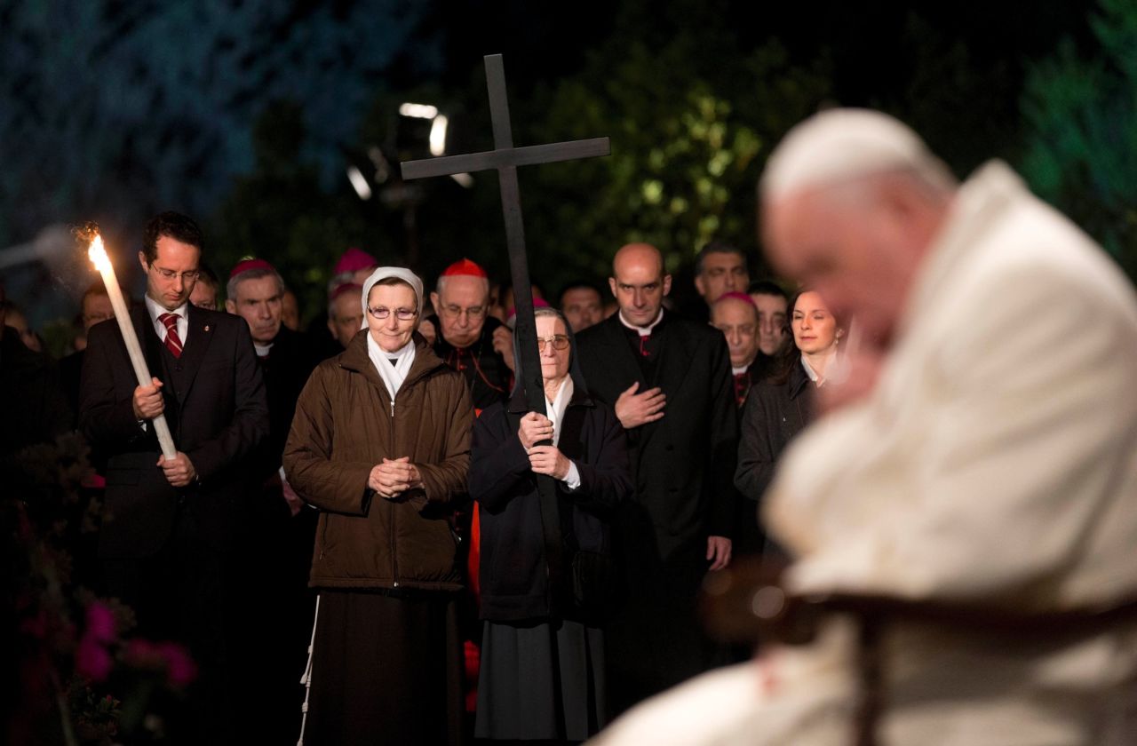 Pope Francis prays during the Stations of the Cross ceremony at the Colosseum in Rome on April 18. 