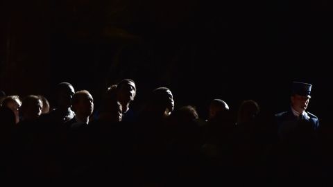 People attend a Good Friday service on April 18 in St. Peter's Basillica at the Vatican.