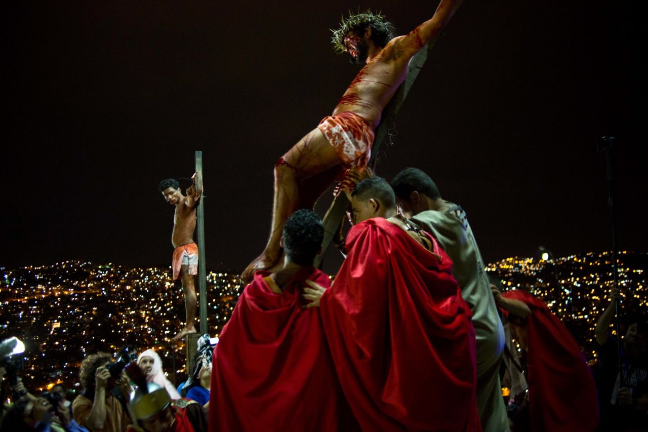 Residents re-enact Jesus Christ's crucifixion on a hilltop in the Petare shanty town during Holy Week in Caracas, Venezuela, on Friday, April 18.