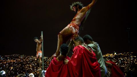 Residents re-enact Jesus Christ's crucifixion on a hilltop in the Petare shanty town during Holy Week in Caracas, Venezuela, on Friday, April 18.