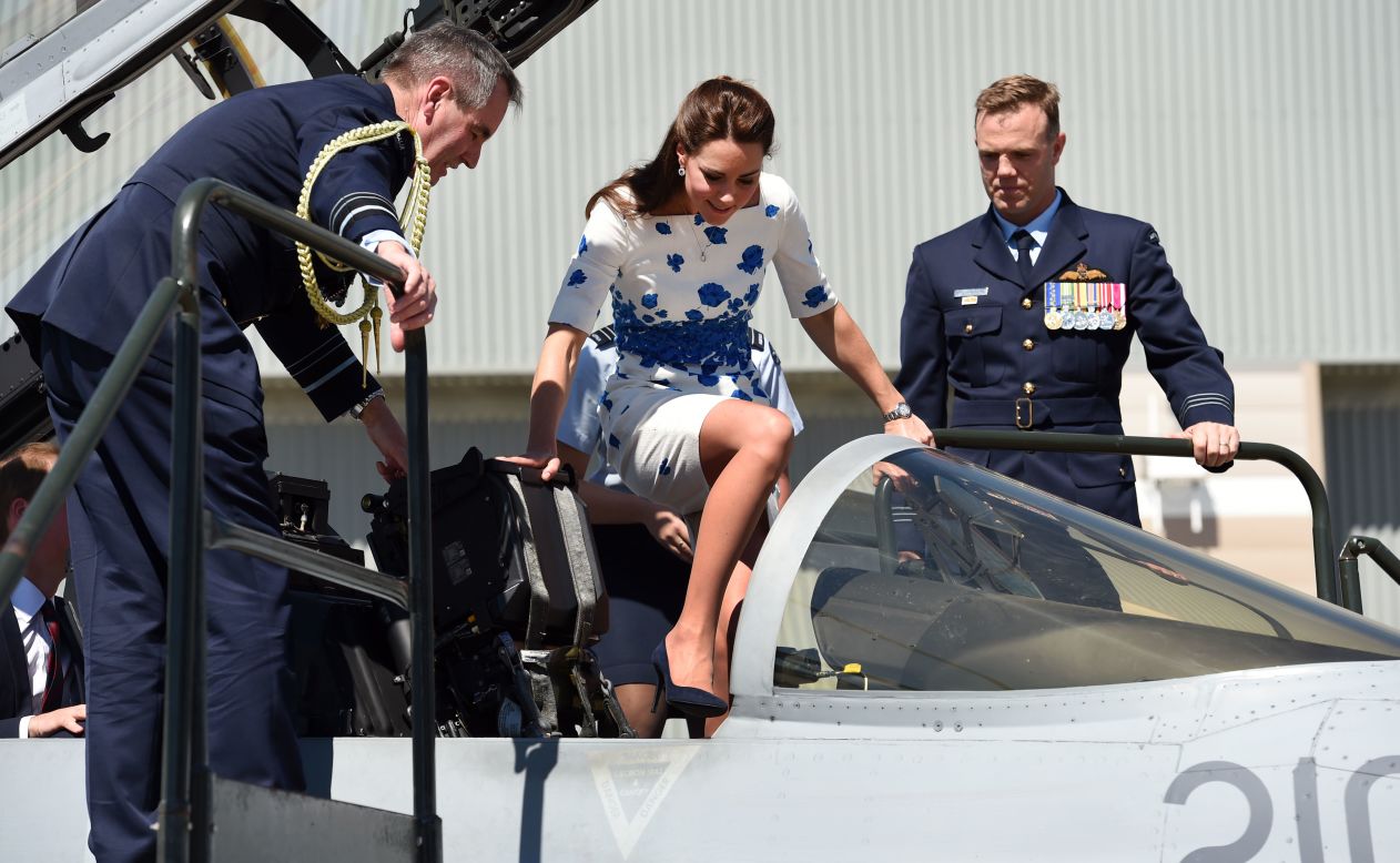 Catherine steps into the cockpit of a RAAF Super Hornet with Air Marshall Geoff Brown and Wing Commander Stephen Chappell at her side on Saturday, April 19.
