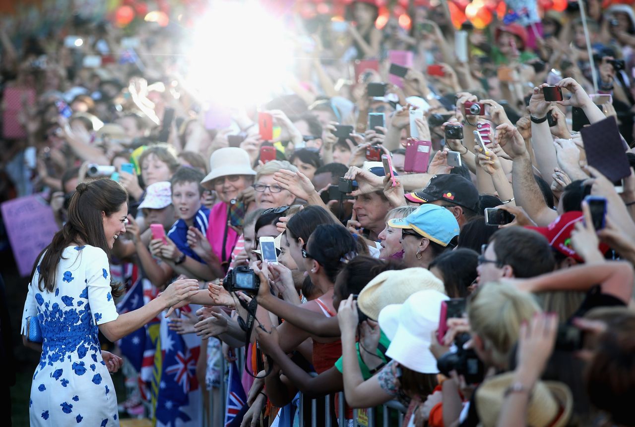 Large crowds cheer and try to catch a glimpse of the duchess on the South Bank in Brisbane, Australia, on April 19.