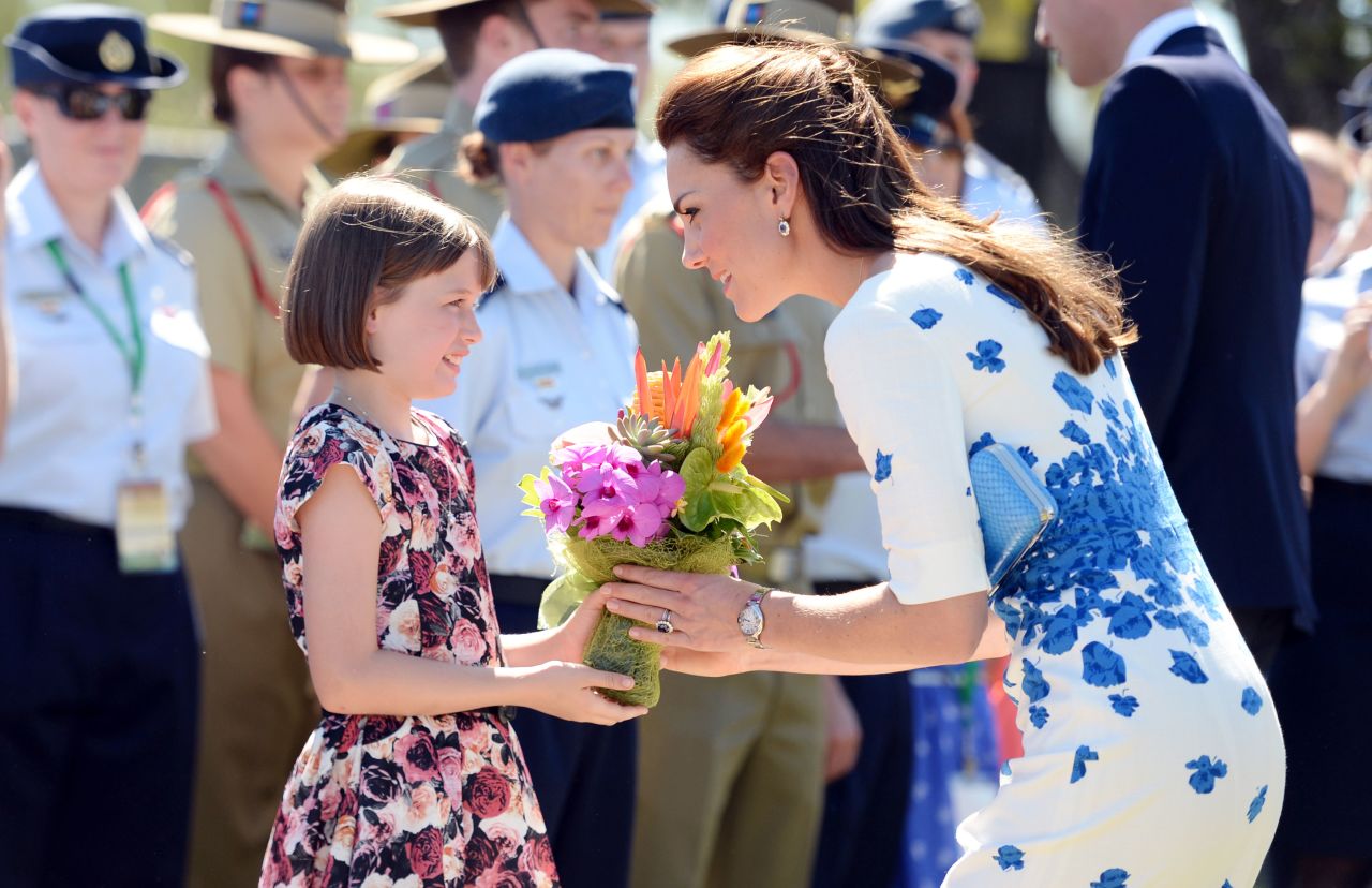 Catherine receives flowers from 9-year-old Ashleigh Kearnan during a visit to the Royal Australian Air Force Base at Amberley on April 19.