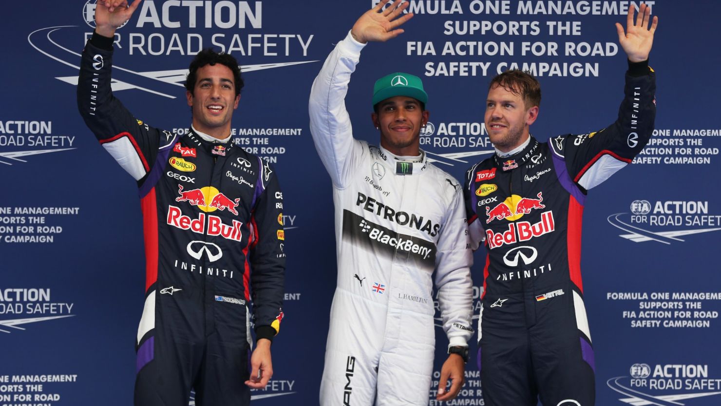 Lewis Hamilton (center) mastered the wet conditions best on Saturday and sits on pole for Sunday's Chinese Grand Prix.
