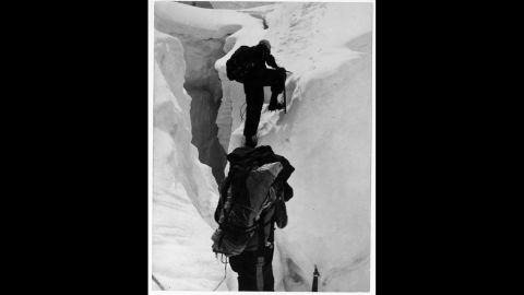 Hillary and Nepalese-Indian mountaineer Tenzing Norgay climb beyond a crevasse on Mount Everest in 1953. Upon meeting George Lowe, who had climbed up to meet the descending duo, Hillary reportedly exclaimed, "Well George, we knocked the bastard off!"