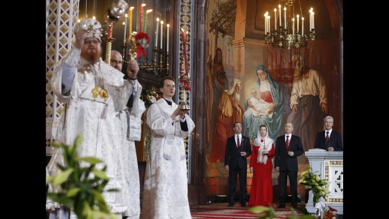 Russian Prime Minister Dmitry Medvedev, from left, his wife, Svetlana, Russian President Vladimir Putin and Moscow Mayor Sergey Sobyanin attend the Orthodox Easter service at the Christ the Savior Cathedral in Moscow.