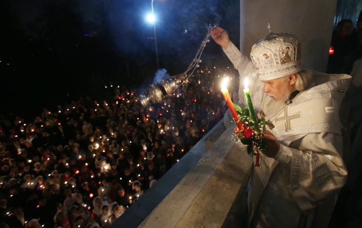 Russian Orthodox Bishop Panteleimon spreads incense during a cross procession at the Church of Christ's Resurrection in Moscow.