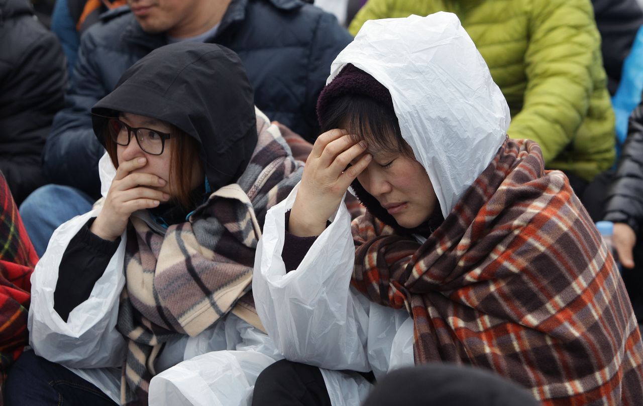 Relatives of missing passengers grieve April 20 in Jindo.