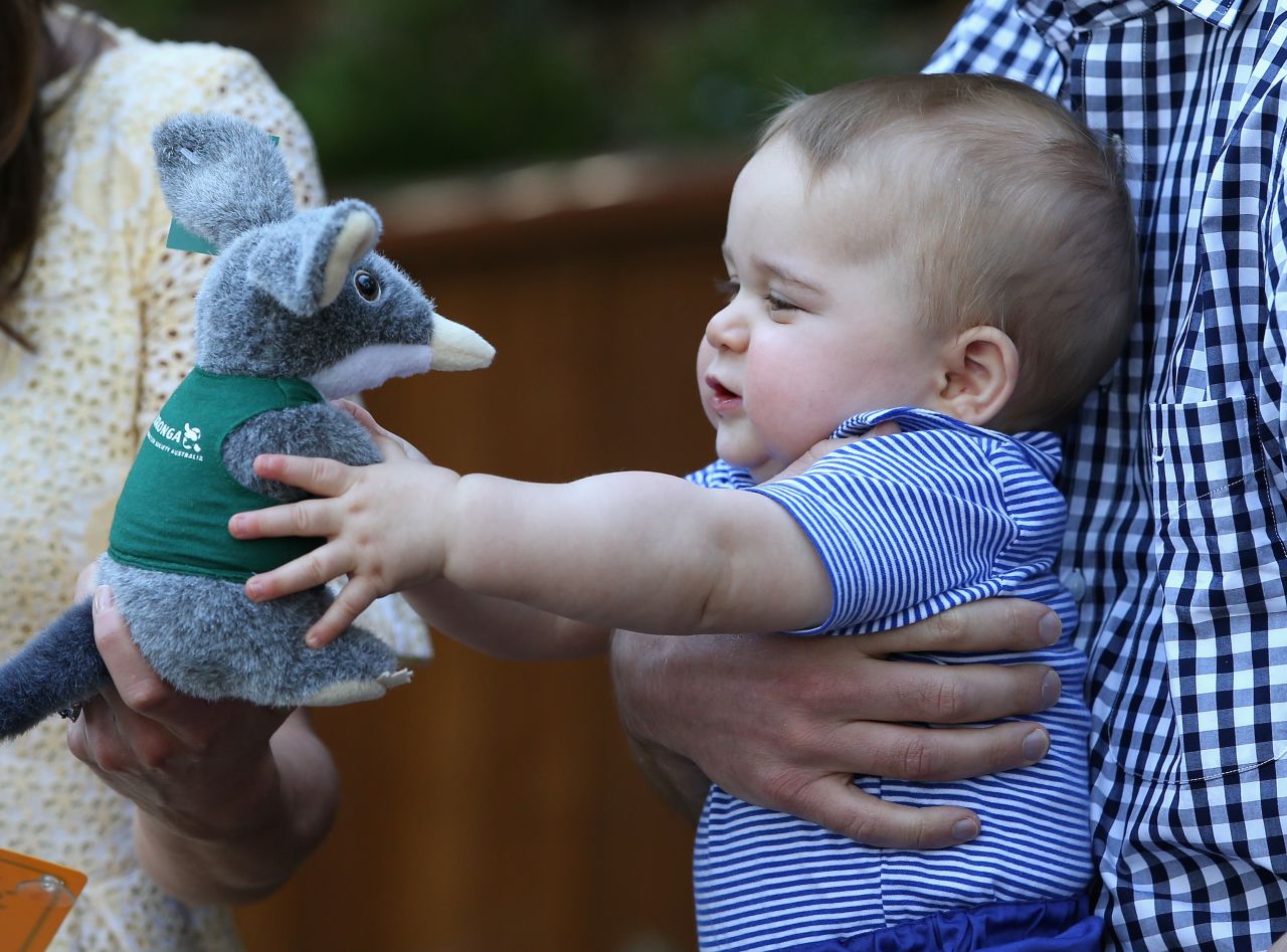 Prince George of Cambridge reaches for a stuffed toy during a visit to Sydney's Taronga Zoo on April 20. The toy represents a bilby, an Australian marsupial on the verge of extinction. The zoo named its Prince George Bilby Exhibit soon after the prince's birth in July 2013.