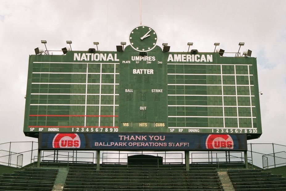 Wrigley Field is one of the last parks to maintain a hand-turned scoreboard. No batted ball has ever hit the 1937 scoreboard, though pro-golfer Sam Snead <a href="http://www.ballparks.com/baseball/national/wrigle.htm" target="_blank" target="_blank">hit it with a golf ball</a> from home plate on Opening Day 1952. Briddick shot this photo while on a tour of the park. 