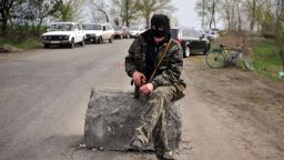 An armed pro-Russian militant stands guard at the check-point on April 20.