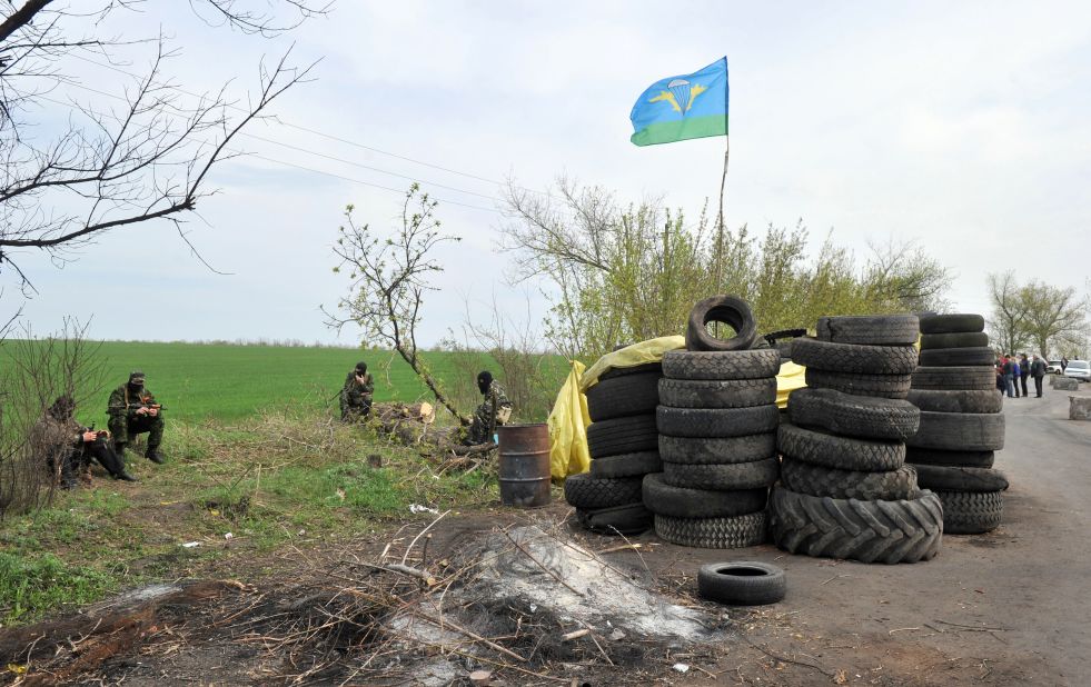 Armed pro-Russian militants stand guard at a roadblock near Slovyansk on April 20. 