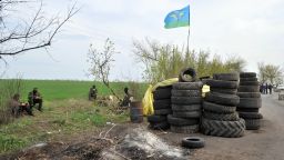 Armed pro-Russian militants stand guard at the check-point near the eastern Ukrainian city of Slavyansk on April 20.
