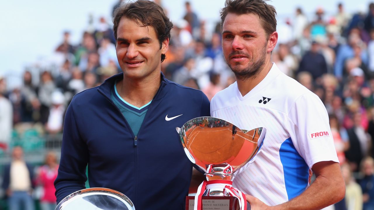 Stanislas Wawrinka of Switzerland with the winners trophy along side runner up Roger Federer of Switzerland in the final during day eight of the ATP Monte Carlo Rolex Masters Tennis at Monte-Carlo Sporting Club on April 20, 2014 in Monte-Carlo, Monaco. (Photo by Julian Finney/Getty Images