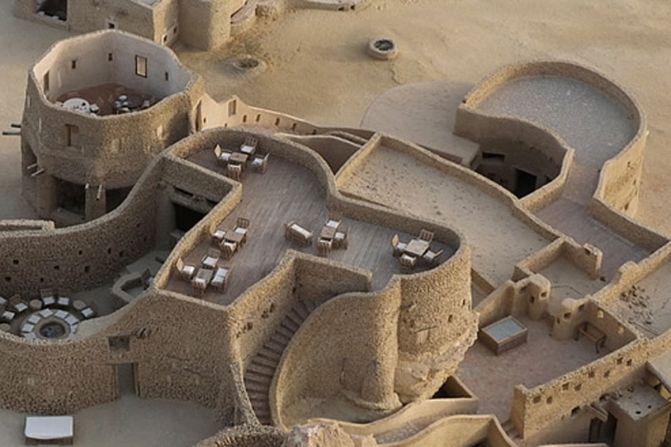 This extraordinary eco-lodge, built from salt rock and mud, sits in the middle of the Saharan oasis at Siwa, eight long, dusty hours' drive from Cairo.