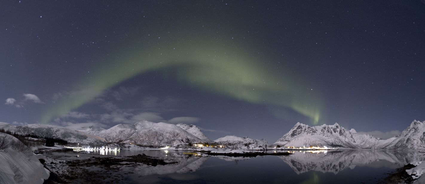 The aurora borealis lights up the night sky in Lofoten, Norway. The spectacular shows occur when charged particles from the solar wind interact with the Earth's atmosphere at the magnetic poles. 
