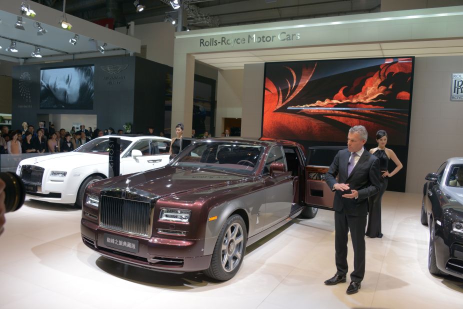 Rolls-Royce CEO Torsten Muller-Otvos unveils the Pinnacle Travel Phantom in Beijng. The car has many bespoke touches that appeal to the super-rich, starting with a two-tone exterior.