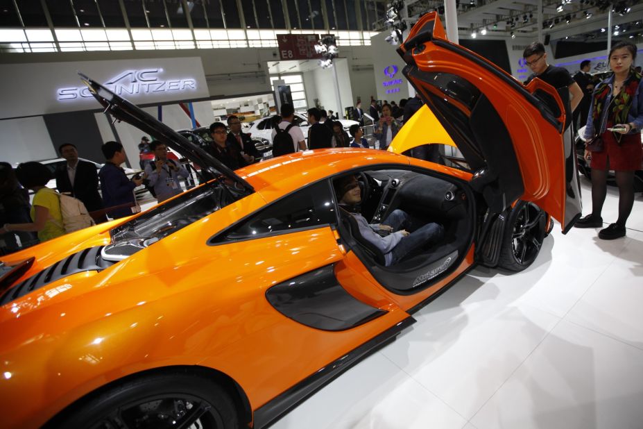 Many brands went all-out to attract media attention. Infiniti invited Hong Kong pop star GEM to promote their cars, while Hyundai snagged South Korean actor Kim Soo Hyun, who has a lot of fans in China. This image show a McLaren car on display at Beijing Auto Show.