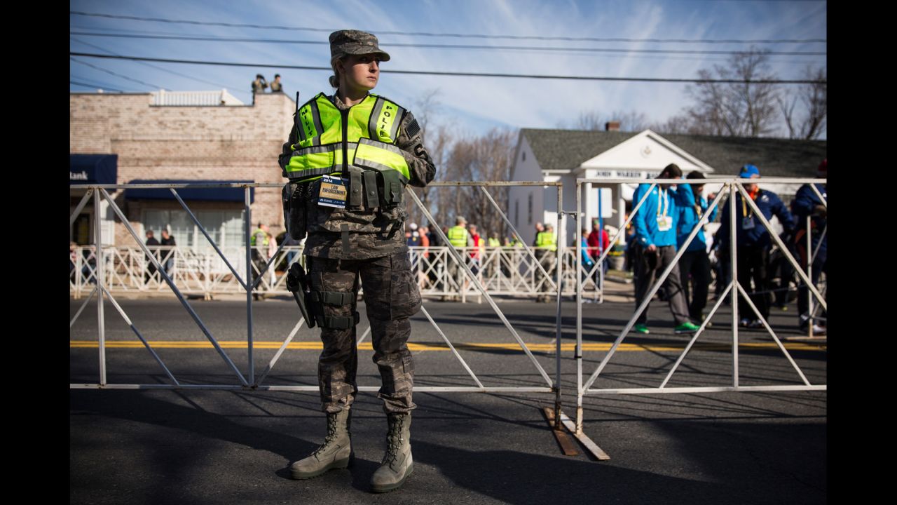 A military police officer stands guard near the starting line of the Boston Marathon in Hopkinton on April 21.