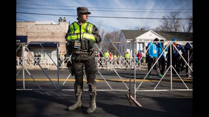 A military police officer stands guard near the starting line of the Boston Marathon in Hopkinton on April 21.