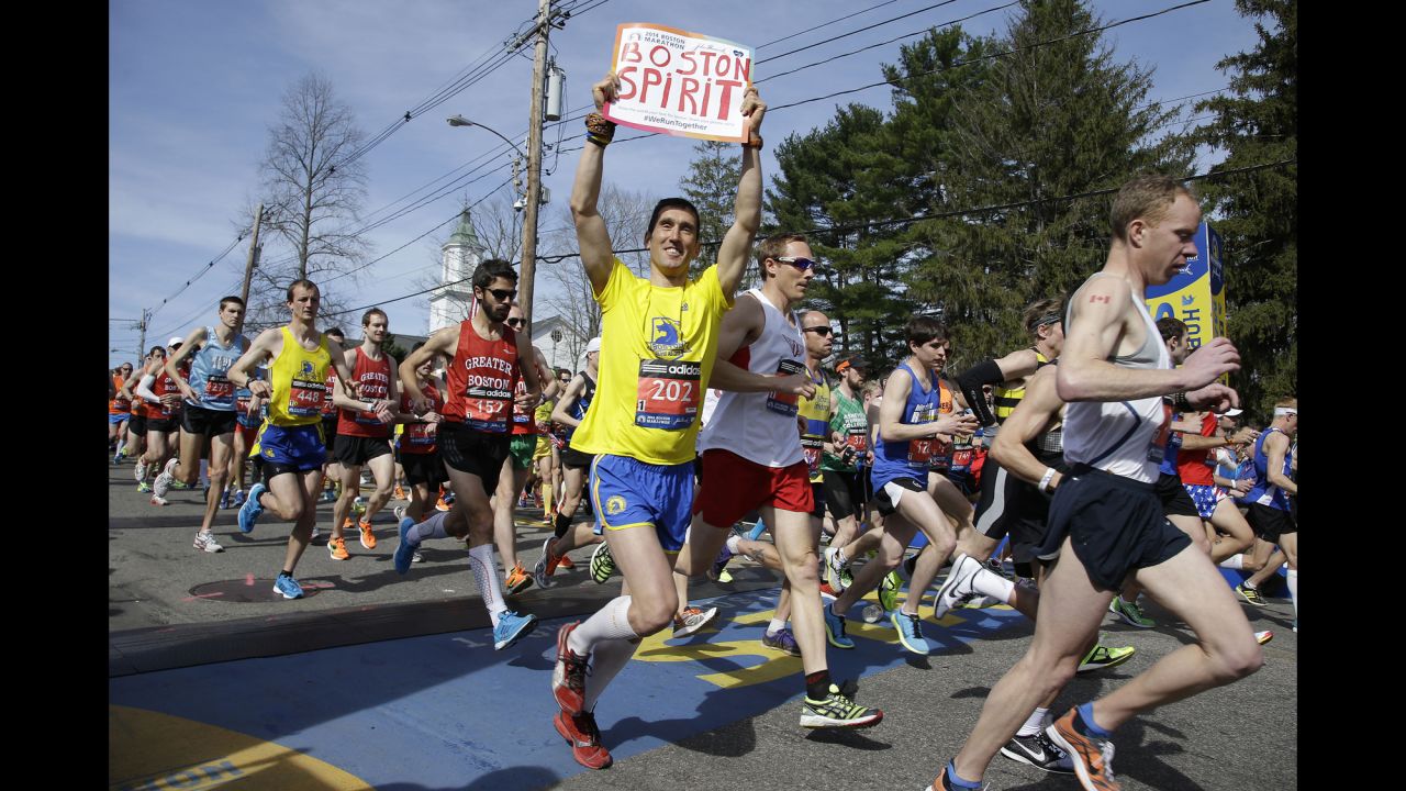 Runners in the first wave of 9,000 participants cross the starting line in Hopkinton, Massachusetts, on April 21.