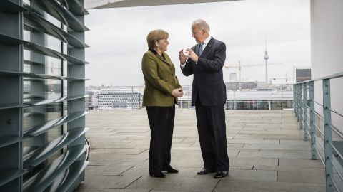 German Chancellor Angela Merkel speaks with then-US Vice President Joe Biden at the Chancellery on February 1, 2013 in Berlin.