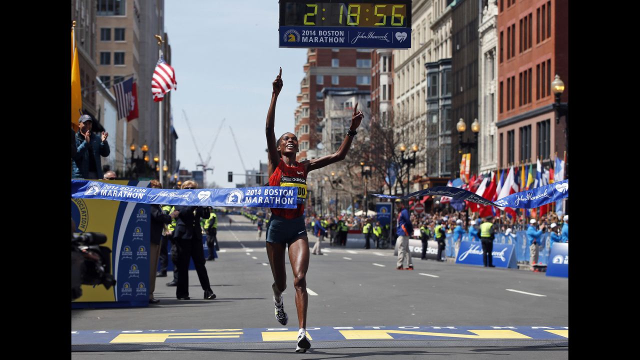 Rita Jeptoo of Kenya breaks the tape to win the women's division of the Boston Marathon.