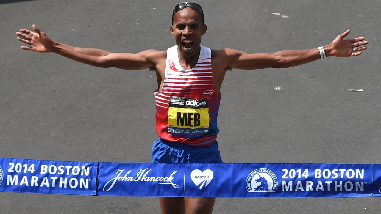 Meb Keflezighi of the United States crosses the finish line to win the men's division of the Boston Marathon in downtown Boston on Monday, April 21.