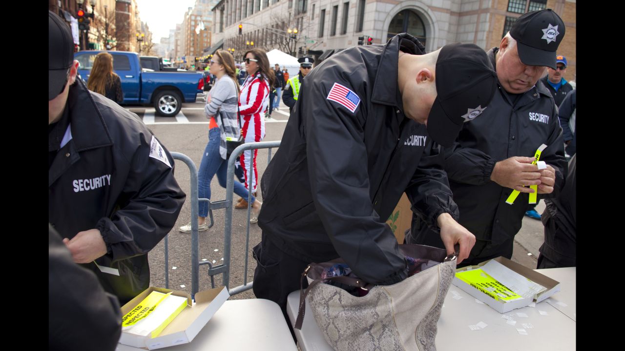 Security officers check bags near the finish line on Boylston Street on April 21.