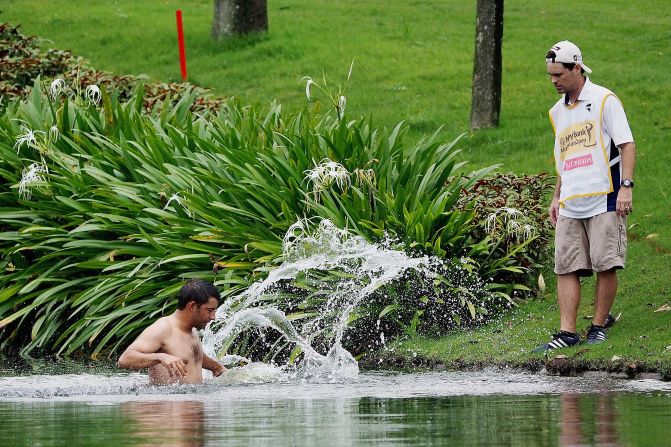 Spain's Pablo Larrazabal jumps into a water hazard to escape hornets on April 18 in Kuala Lumpur, Malaysia. "It was the scariest moment of my career, for sure. I've never been so scared," he said. Larrazabal birdied the hole he was on when the attack occurred -- the 14th -- then completed his second round in four-under-par 68, making the halfway cut of the European Tour event.