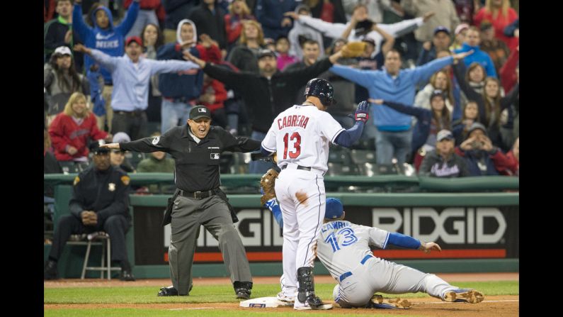 The crowd at Progressive Field in Cleveland helps third base umpire Tim Welke call Cleveland Indians baserunner Asdrúbal Cabrera safe on April 18. 