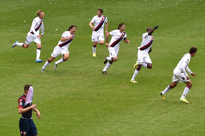 Cagliari teammates celebrate after Victor Ibarbo (second from right) scores his team's second goal during the Series A match between Genoa CFC and Cagliari Calcio on April 19 in Genoa, Italy. 
