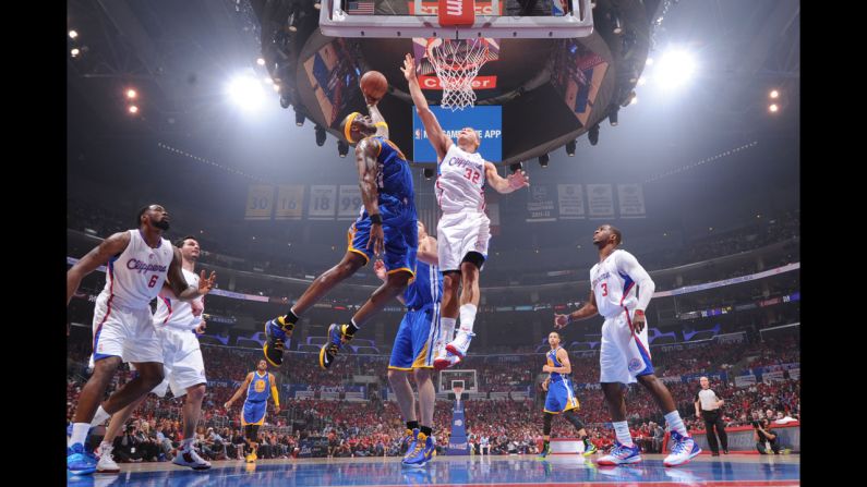 Golden State Warriors player Jermaine O'Neal shoots against Blake Griffin of the Los Angeles Clippers during game one of the Western Conference Quarterfinals during the NBA Playoffs on April 19 in Los Angeles.