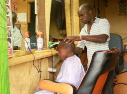 Buken Makokha inside his barbershop.