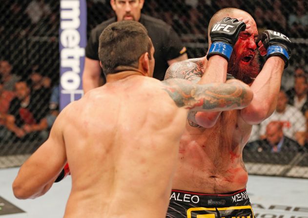 Fabricio Werdum, left, punches Travis Browne in their heavyweight bout during the FOX UFC event on April 19 in Orlando.