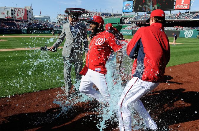 Outfielder Denard Span of the Washington Nationals is doused with Gatorade by Drew Storen and Tyler Clippard after driving in the game-winning run in the ninth inning against the St. Louis Cardinals on April 20 in Washington. The Nationals won the game 3-2.