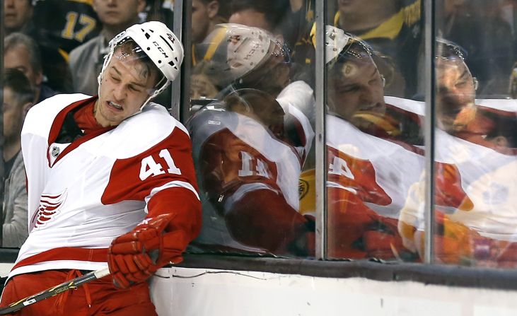 Detroit Red Wings' Luke Glendening gets knocked into the glass during a first-round NHL hockey playoff series against the Boston Bruins in Boston on April 20. The Bruins beat the Red Wings 4-1.