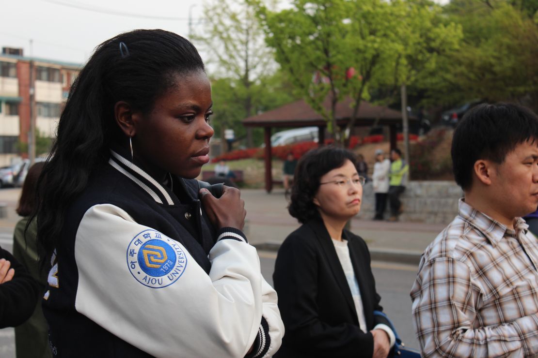 Judith Ambe grieves for friends missing after the Sewol incident at Danwon High School in Ansan, South Korea. 