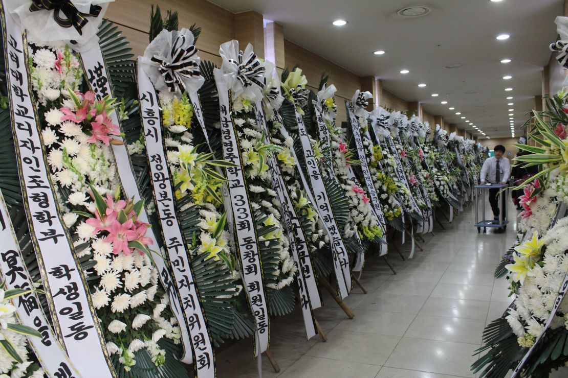 Flowers for Sewol crew member Jee Young Park pack a hallway at the funeral hall in Incheon, South Korea.