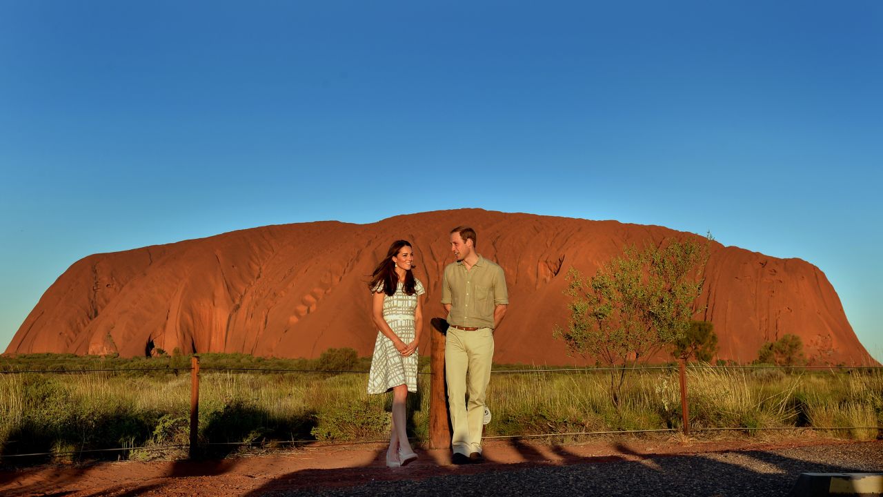 The royal couple pose in front of Ayers Rock in Australia on Tuesday, April 22. 