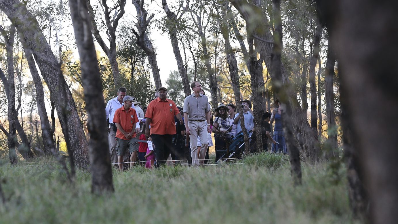 Prince William is guided along the Kuniya walk at Uluru, Australia, with a group on April 22.