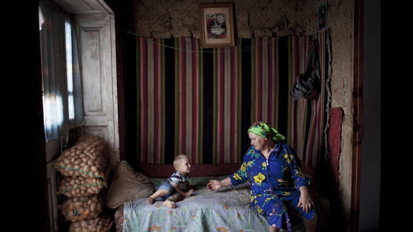 Italian photographer <a href="http://www.myriammeloni.com/" target="_blank" target="_blank">Myriam Meloni</a> won the Lifestyle category for her work in Moldova, where she photographed families impacted by migration. The woman in this photo cares for her three grandchidlren because her daughter moved abroad in search of work opportunities. "I was attracted by the gesture of love and complicity between them," she said.