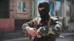 A pro-Russian militant stands guard in front of the occupied Ukraine Security Service building on April 21, 2014 in Slovyansk, Ukraine.