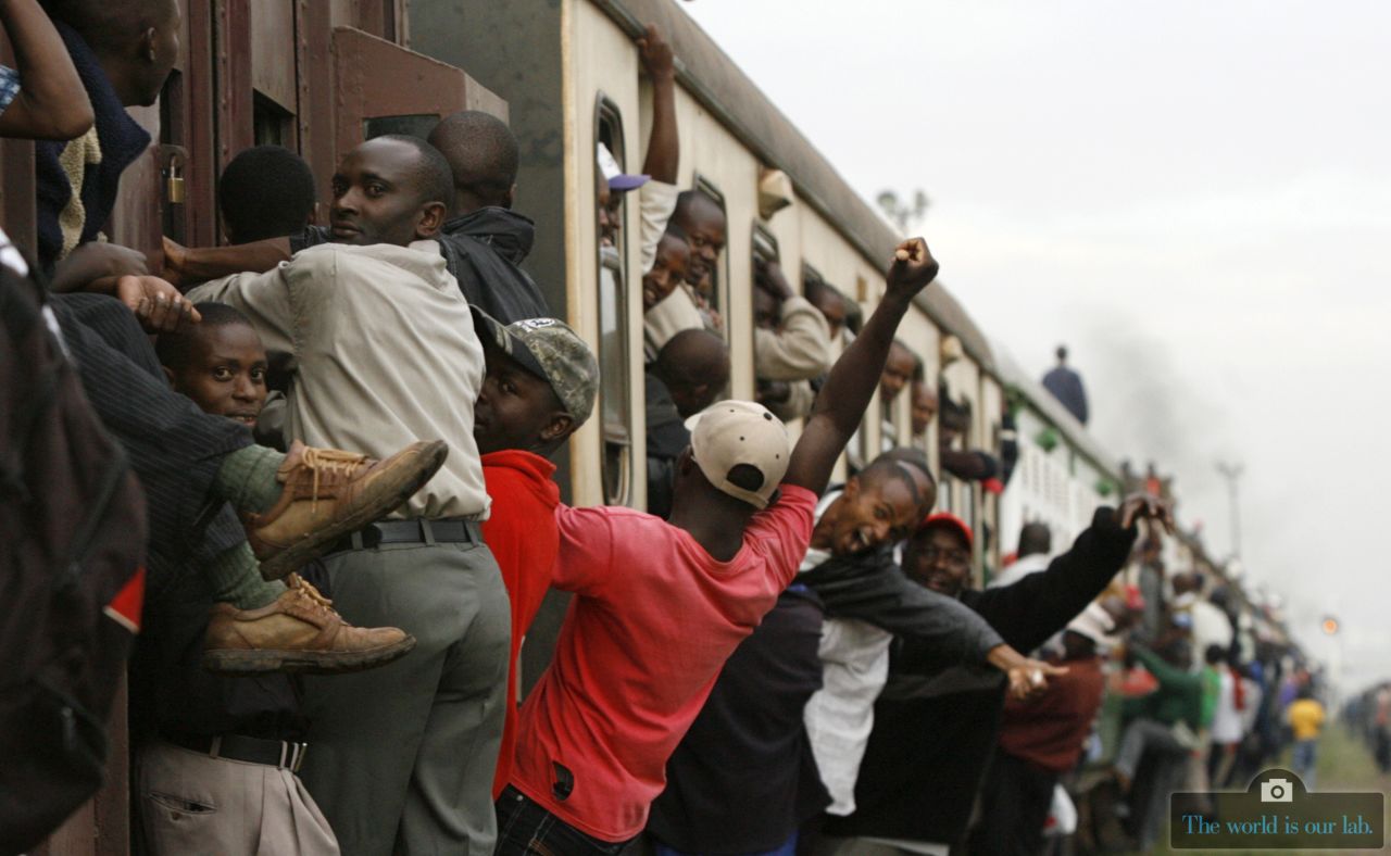Passengers ride an overloaded commuter train at the Makadara station in Kenya's capital Nairobi. The larger-than-normal numbers were due to a strike by minibus drivers and conductors.