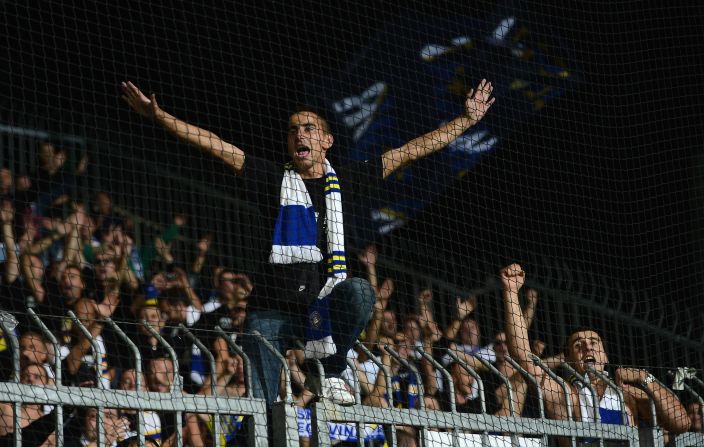 A Bosnian fan leads the chants at the Štadión pod Dubňom before the World Cup Group G qualifier against Slovakia in September 2013. 
