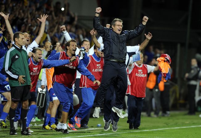 Bosnia's coach Safet Susic (C) leads the celebrates as the final whistle blows.