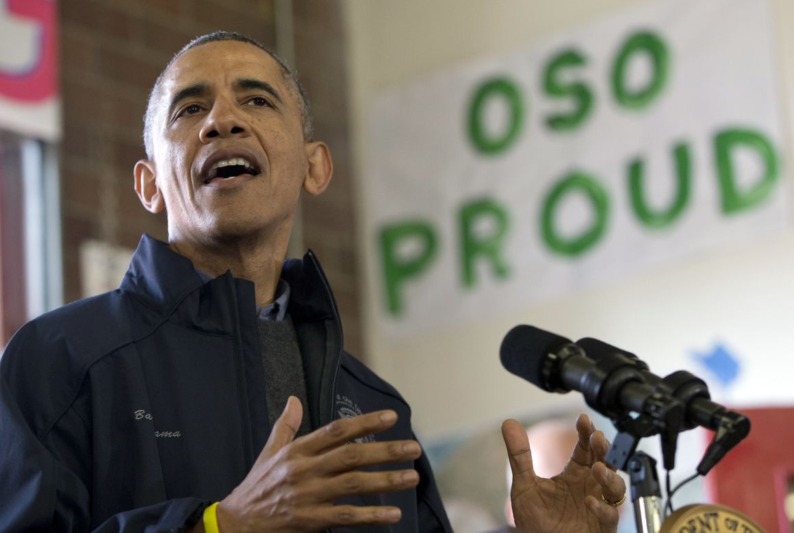 President Obama speaks to first responders, recovery workers and community members on Tuesday, April 22, at the scene of the deadly landslide that devastated Oso, Washington, one month before. The landslide crossed the North Fork of the Stillaguamish River and caused multiple deaths and massive damage.