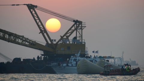 The sun sets over the site of the sunken ferry on April 22.